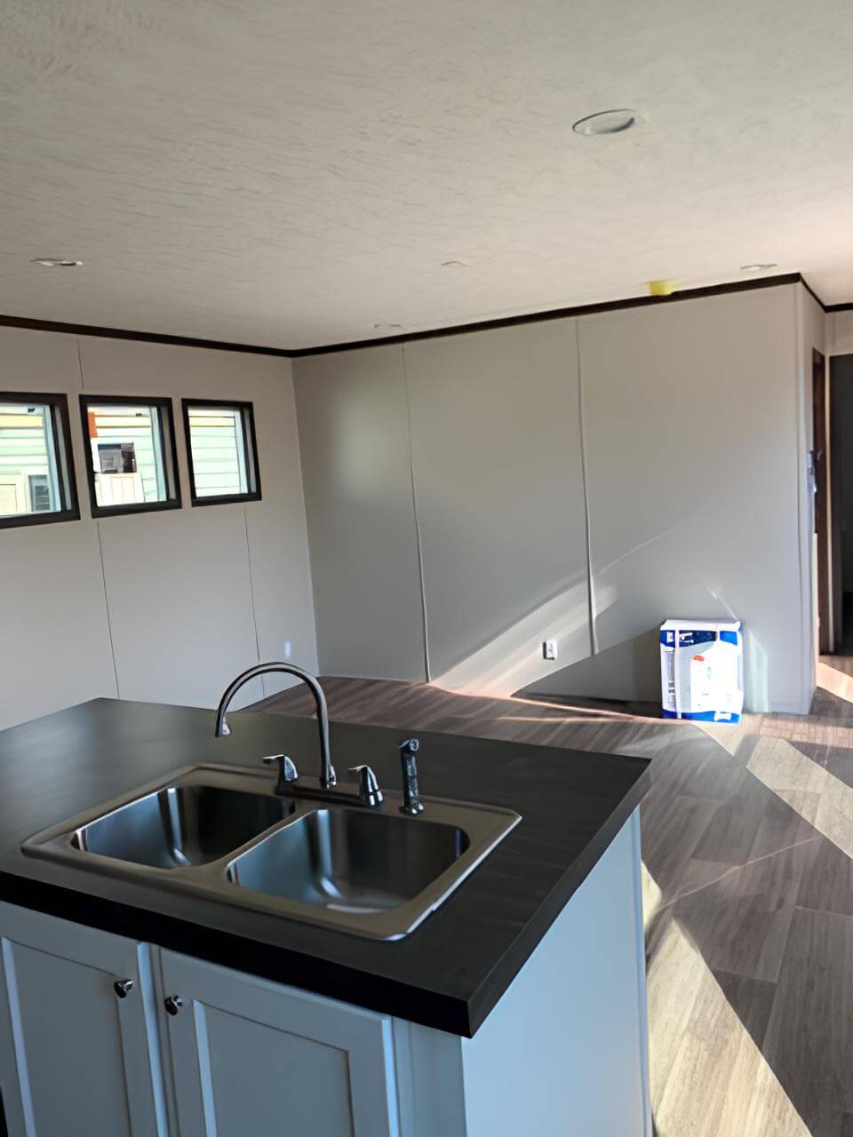 Kitchen island and double sink in The Spirit manufactured home