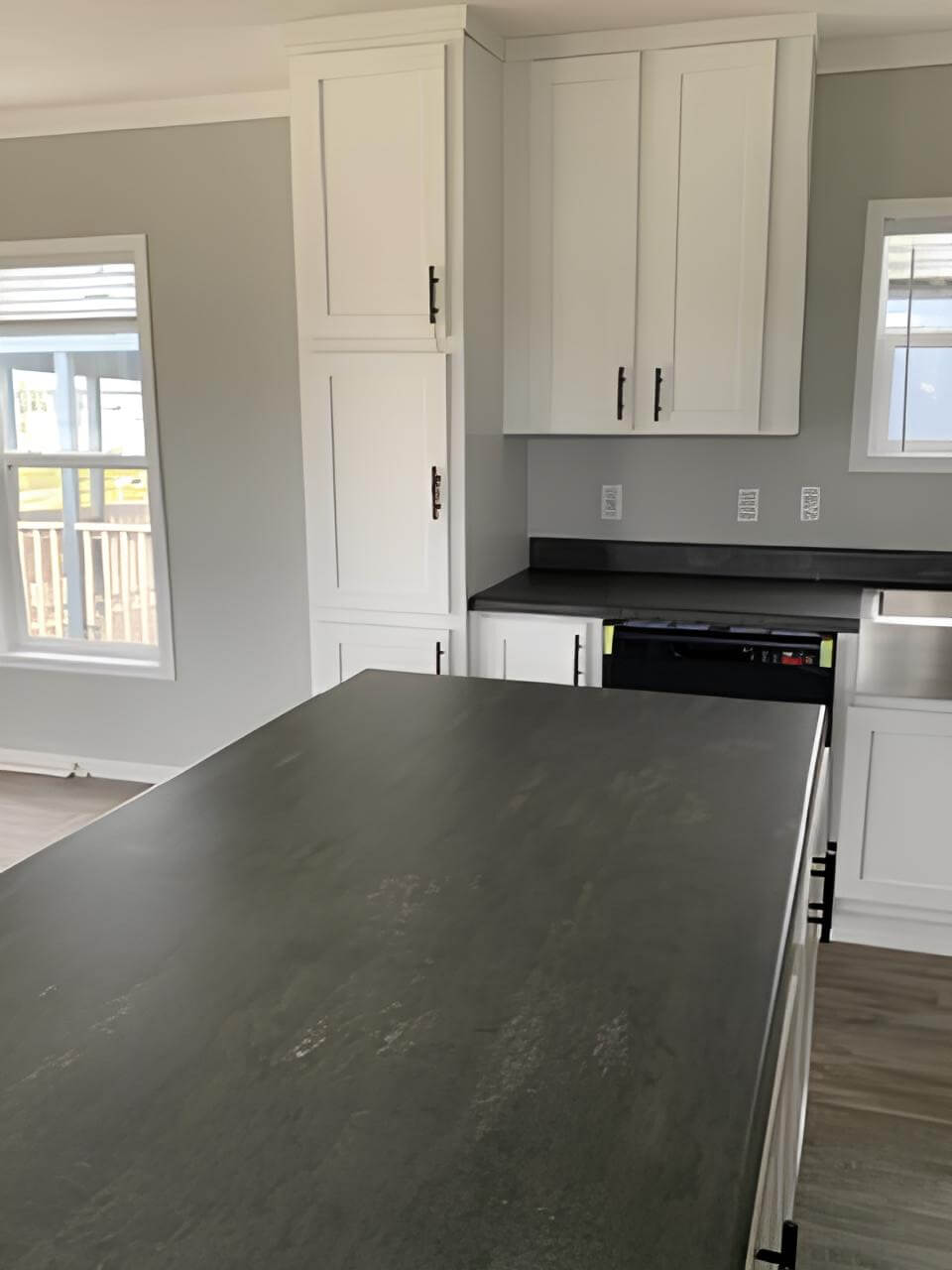 Large kitchen island and pantry cabinets in the 900-square-foot Bobby Jo
