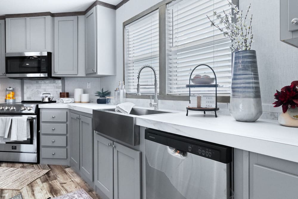Farmhouse sink and dishwasher in The Murphy manufactured home