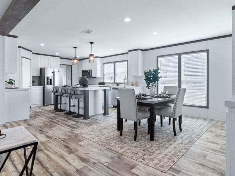 Open kitchen and dining room in this 5-bedroom double-wide