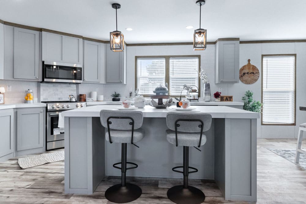 Kitchen island with bar seating in The Murphy manufactured home