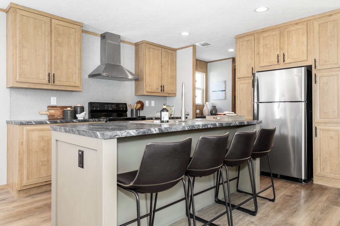 Kitchen island with farmhouse look in the Clayton Epic Mariner manufactured home
