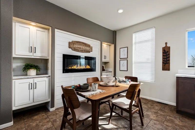 Dining area in The Odyssey XL 3256 by Champion Homes