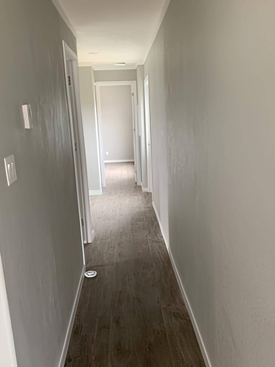 Interior hallway connecting the bedrooms and bathrooms in the Bobby Jo