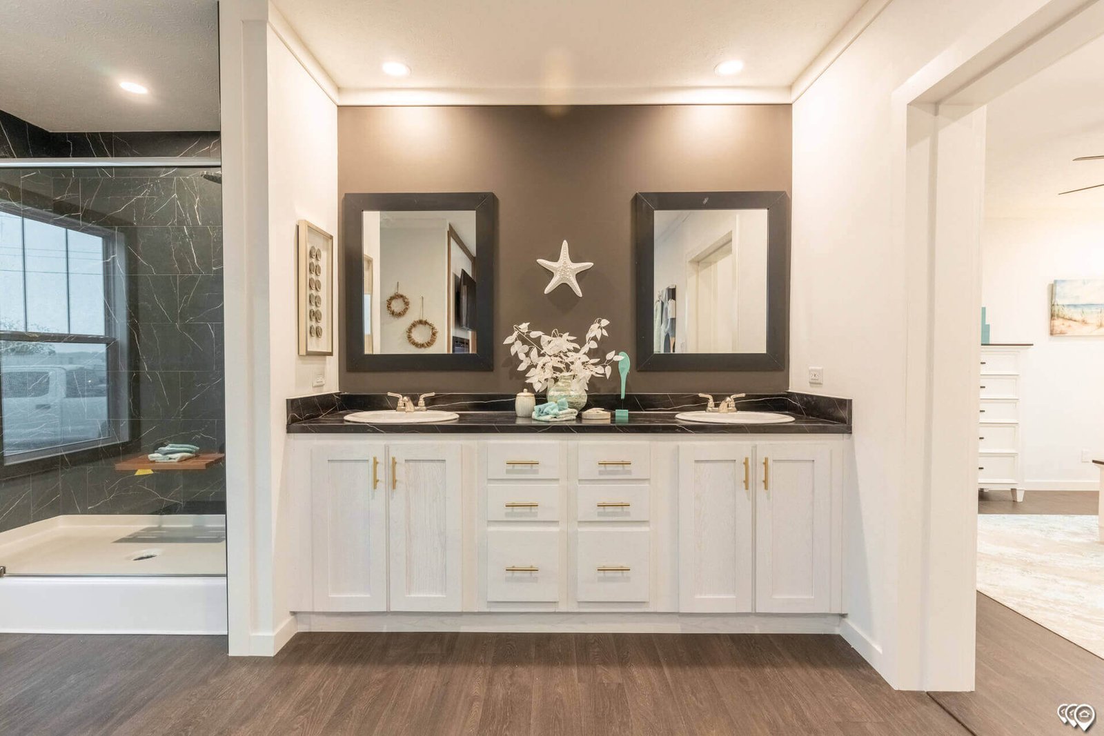 Primary bathroom double vanity with white cabinetry in The Trinity CS-3242