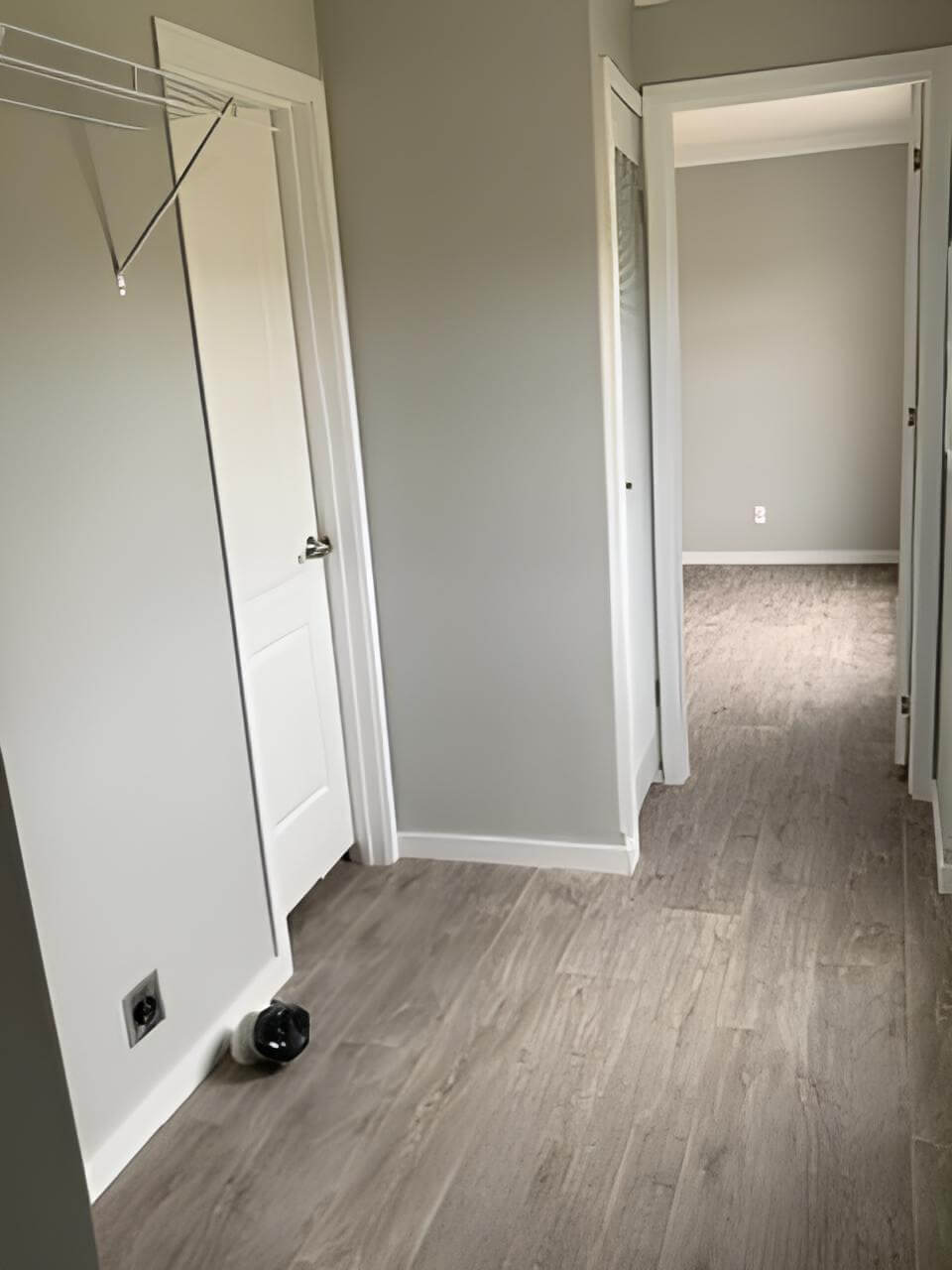 Laundry area with washer hookup and storage shelf in the Bobby Jo