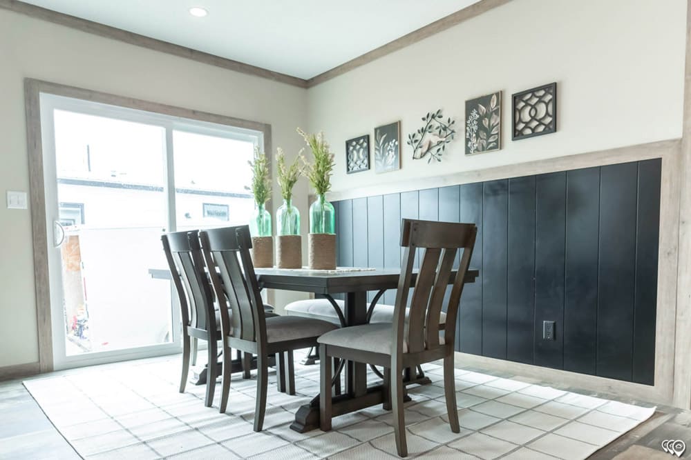 Bright dining area with accent wall in The Shoal Creek manufactured home