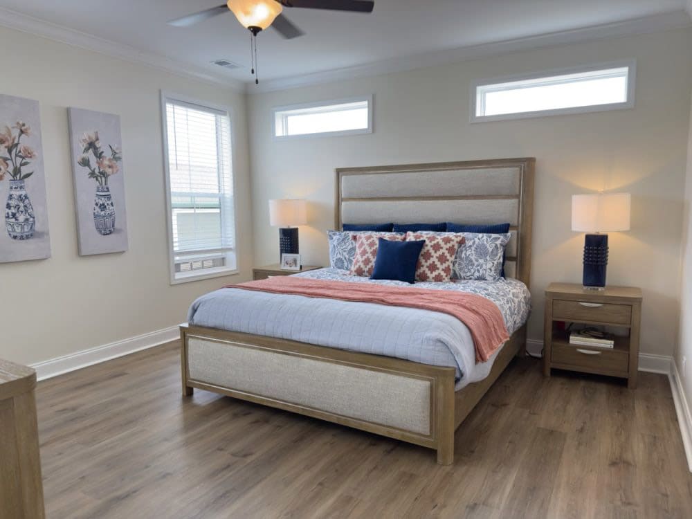 Primary bedroom with high windows in The Riverwalk 3-bedroom doublewide