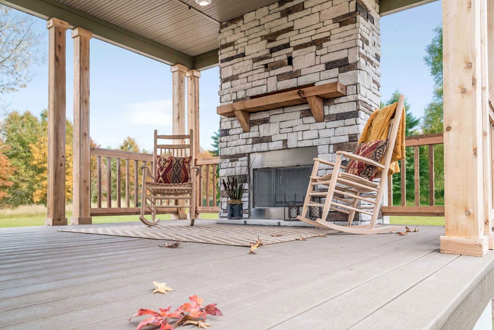 Covered fireplace porch on The Nandina home for sale in Bastrop County