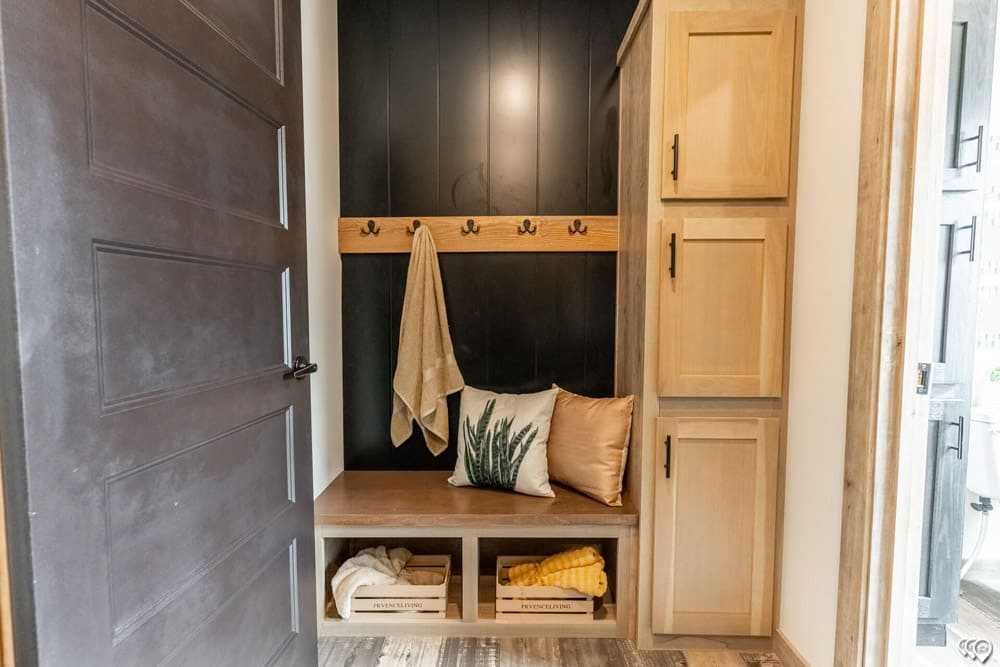 Mudroom bench with storage and coat hooks in The Shoal Creek
