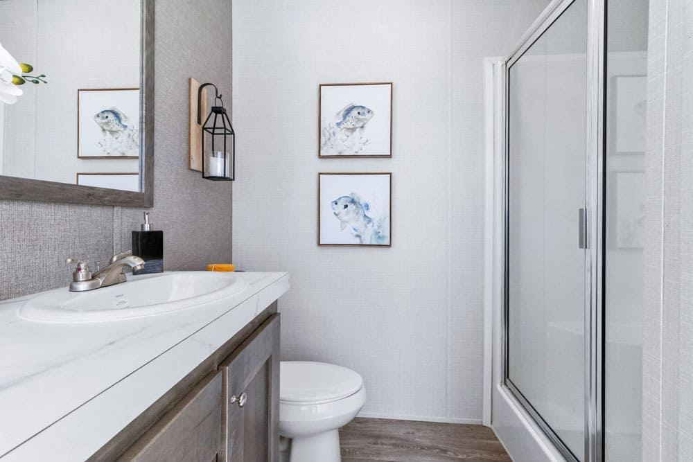 Glass shower and vanity in the Jessup Wilson primary bathroom