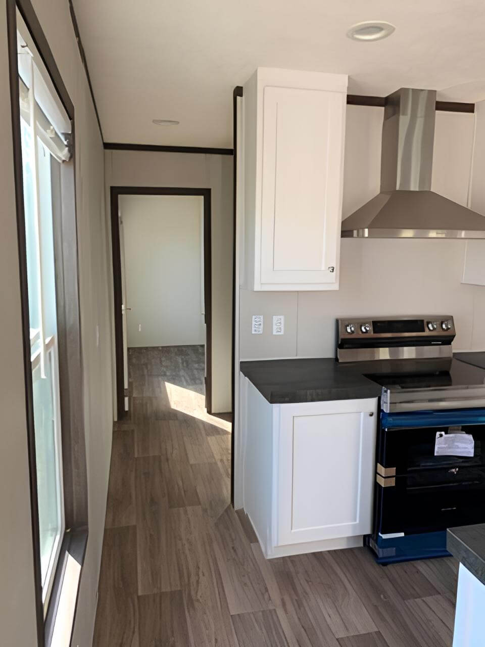 Modern range hood and hallway in The Spirit by Clayton MiYo