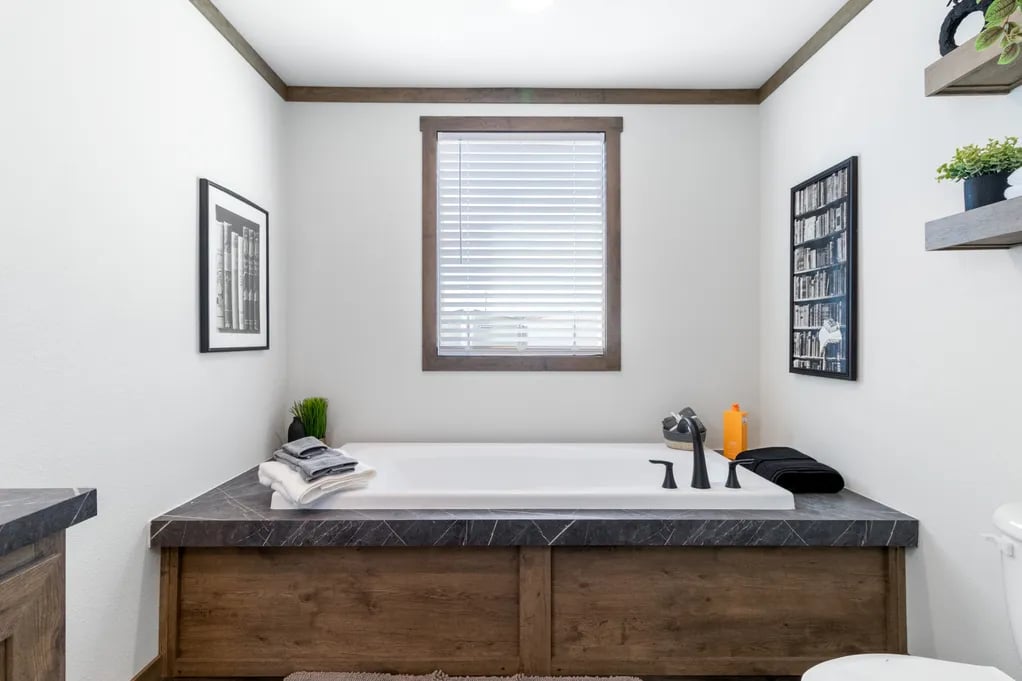 Wide soaking tub in the Clayton NXT Isabella Elite primary bathroom
