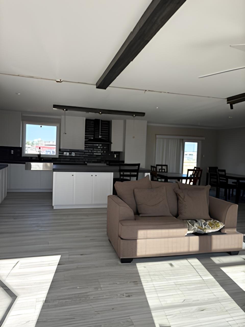 Open concept living room and kitchen in 2300 sq ft manufactured home #180