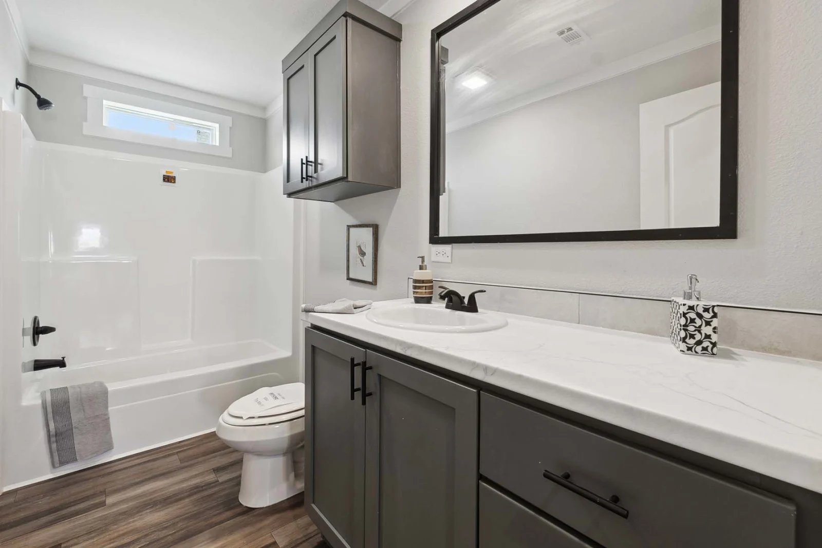 Guest bathroom in the Winter Series 32x56H by Champion Homes for sale in Colorado