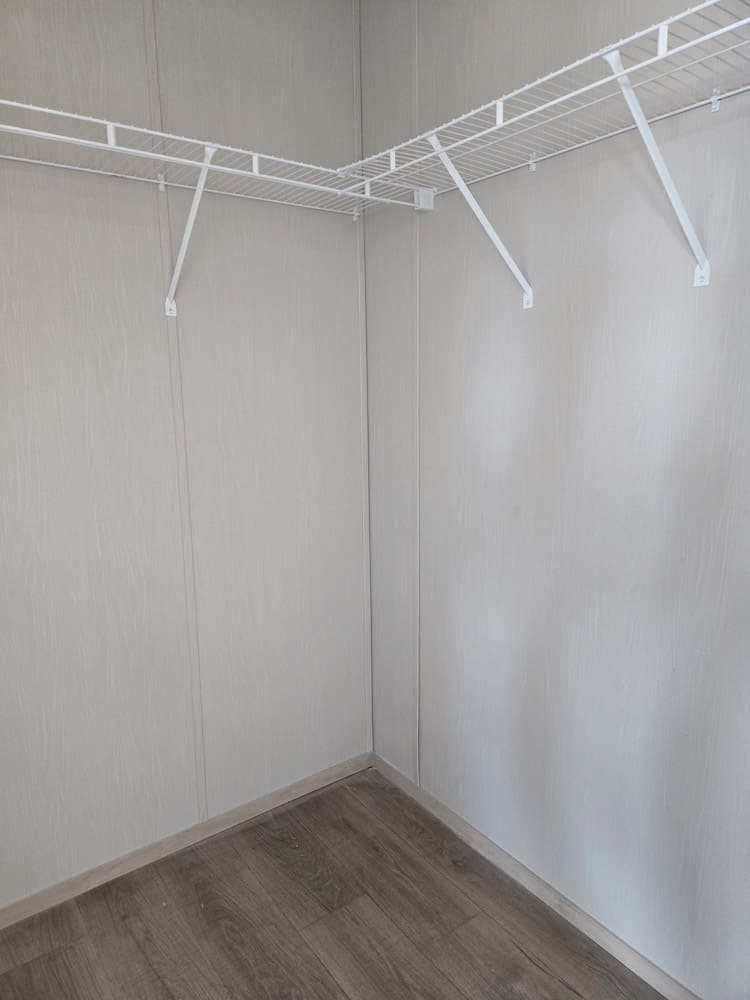 Walk-in closet with wraparound wire shelving in the Clayton Epic Hudson home in El Paso