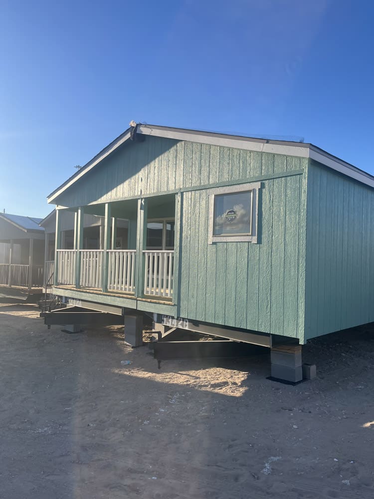 Side view of the covered front porch in the Legacy S-2856-32 FLP 3-bedroom manufactured home