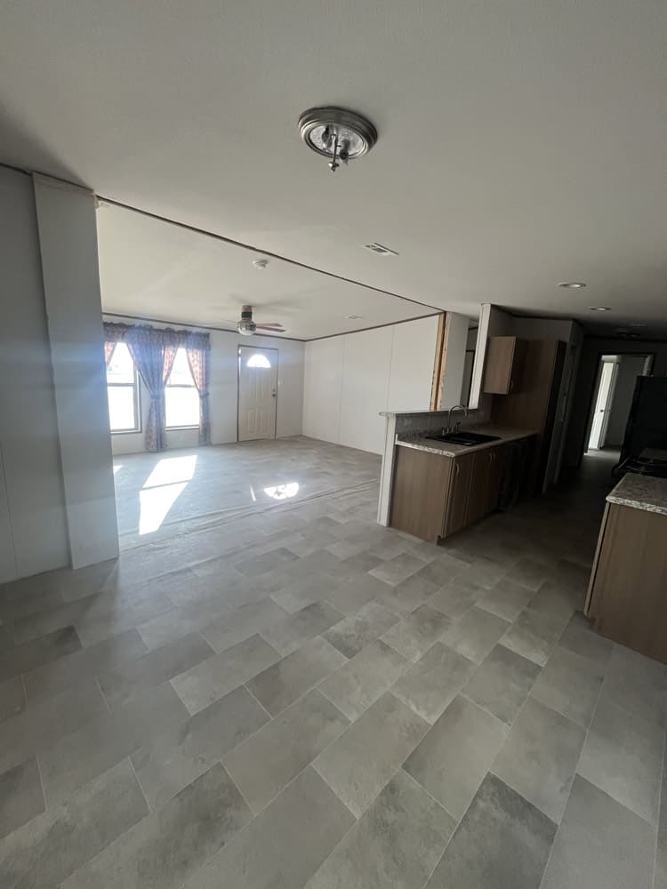 Dining area opening to the living room in the Legacy S-2468-42A 24x68 home in El Paso