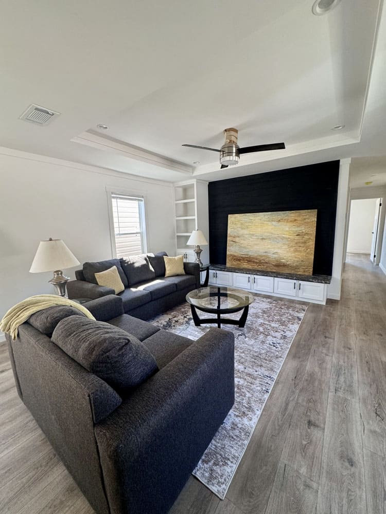 Modern living room in The Cami manufactured home by Champion Homes