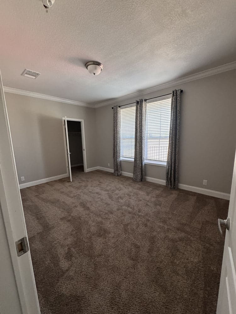 Bright secondary bedroom with closet in this 4 bedroom Franklin Homes modular home