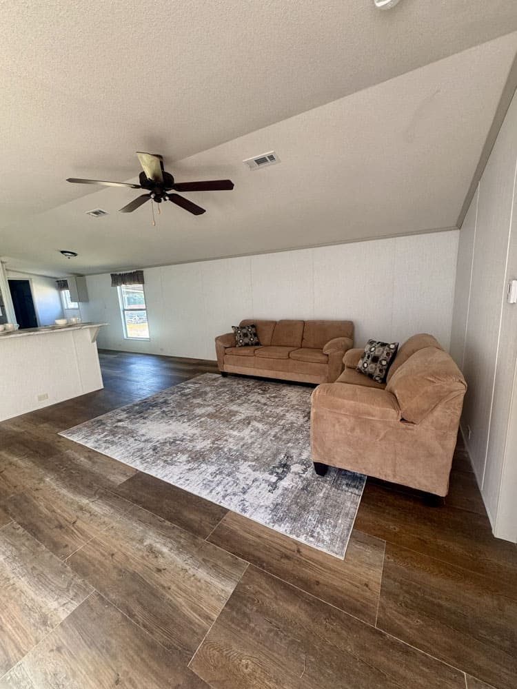 Open living room in the H-1880-32E singlewide home near Conroe, Texas