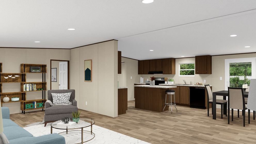 Open floor plan with kitchen island in The Thrill by TRU Homes
