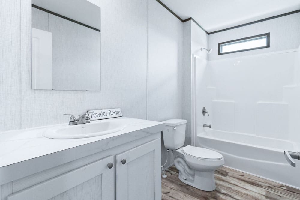 Guest bathroom with tub and shower in the Jessup Royal 5-bedroom home