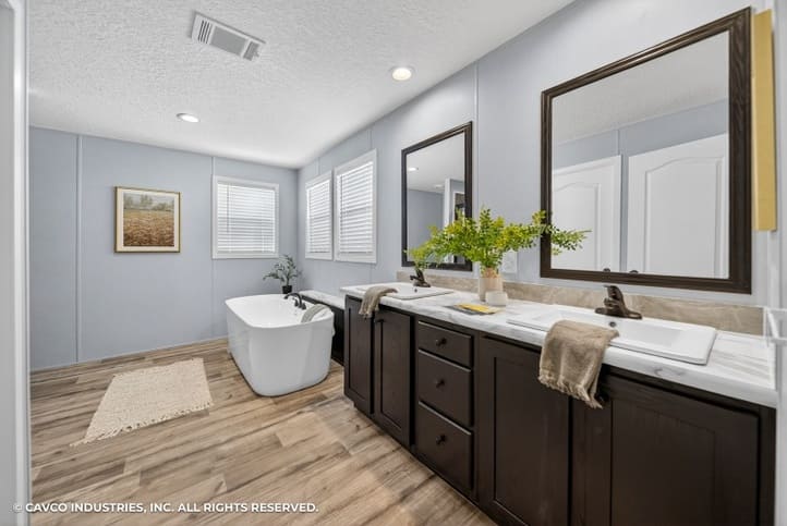 Large primary bath with double vanity and soaking tub in The Vantage