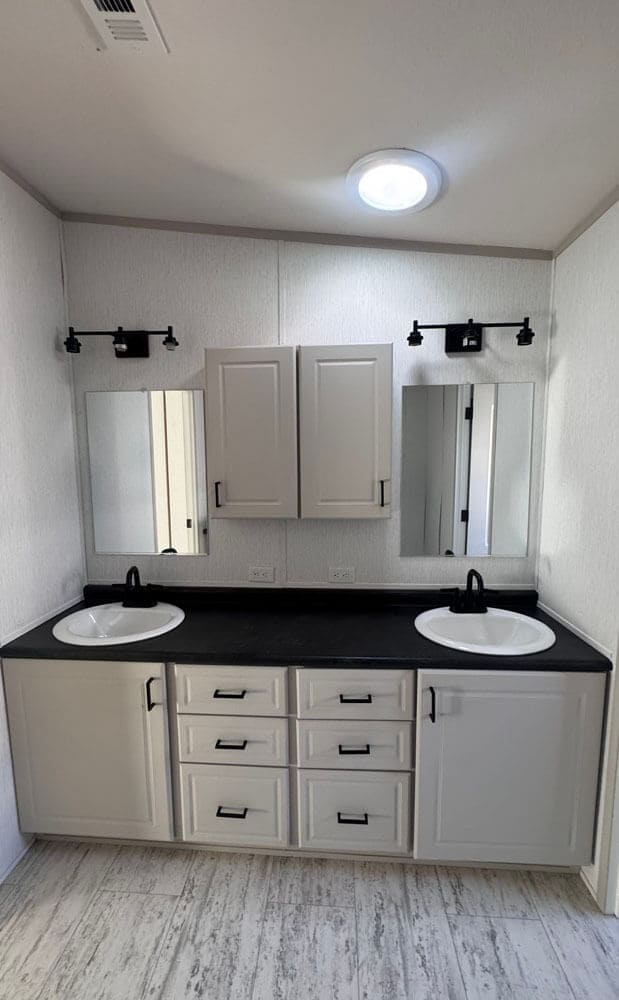 Dual-sink primary bathroom vanity in The Lucia doublewide