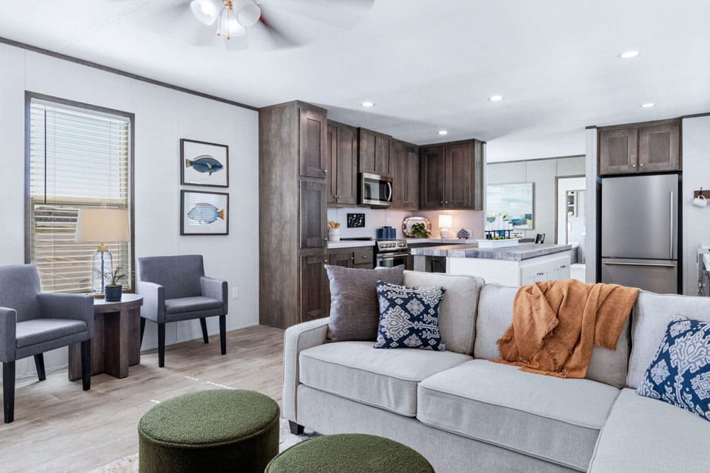 Spacious sectional living area beside The Wilson manufactured home kitchen