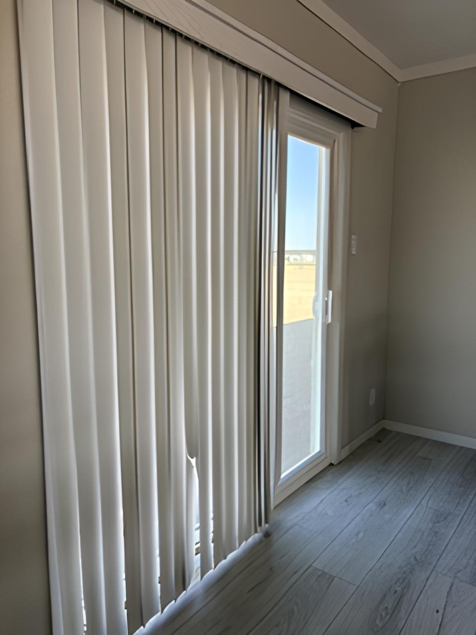 Sliding glass patio door off the open living area of doublewide #180