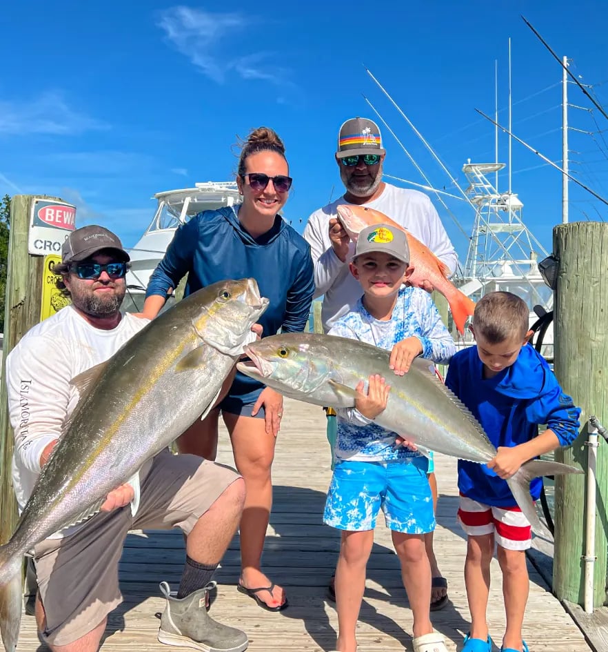A family fishing together on a charter boat out of Robbie’s in Islamorada