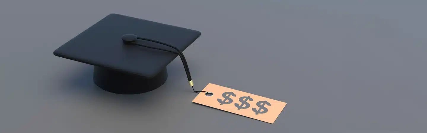 Graduation cap with a price tag showing dollar signs attached to the tassel, symbolizing the cost of education.