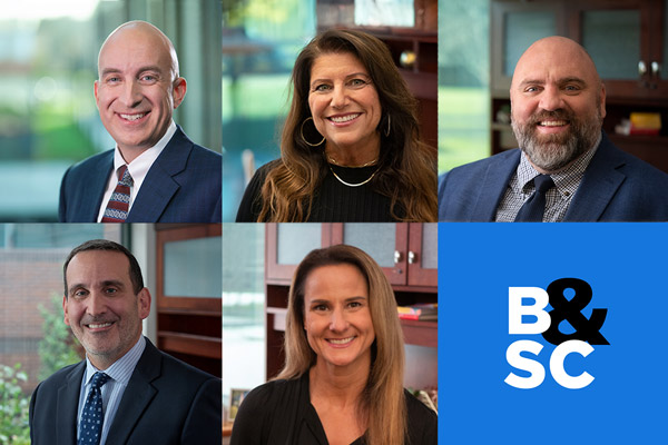 A collage of five professional headshots of staff members next to a blue square featuring the white and black “B&SC” logo.