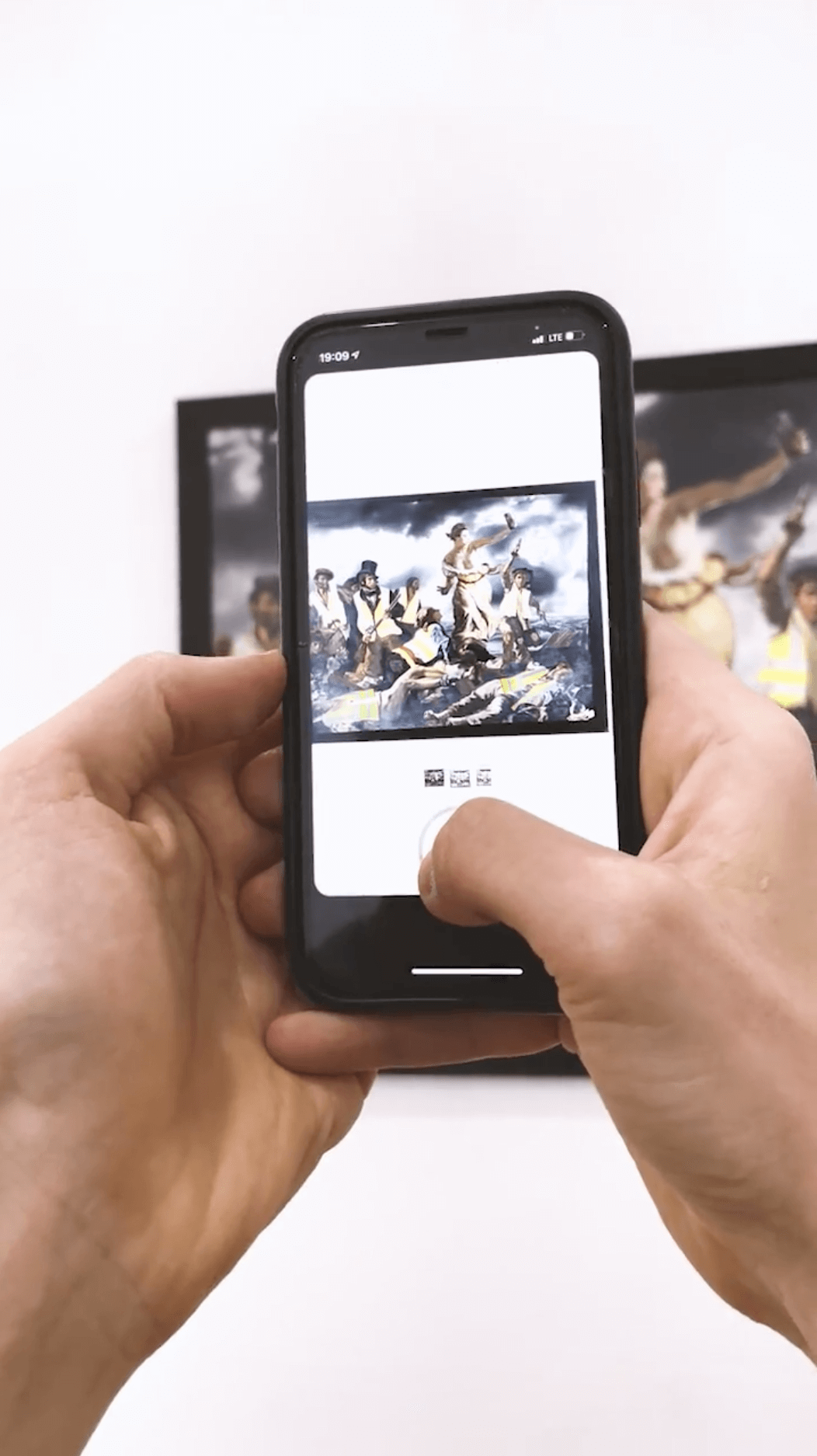 Augmented Reality on phone display, while a person filming classic painting.