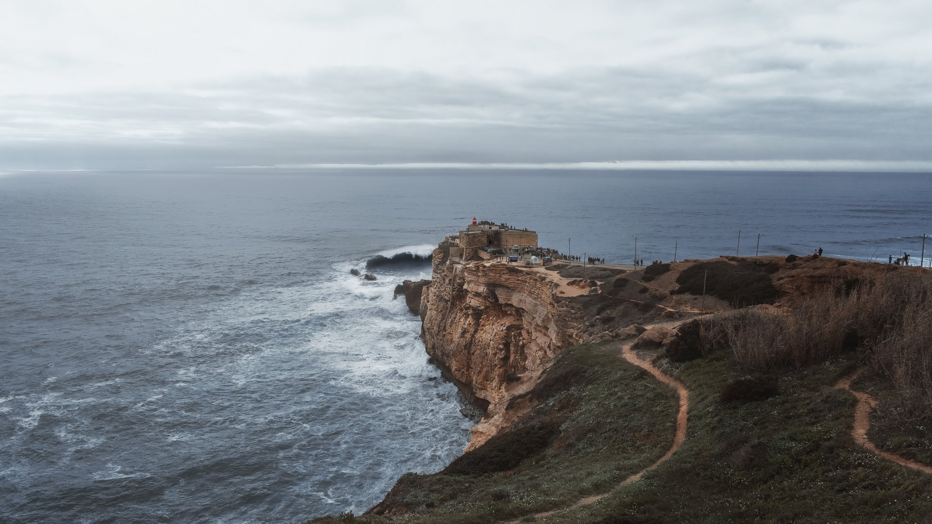 Big waves of Nazaré and fort of Sao Miguel Arcanjo