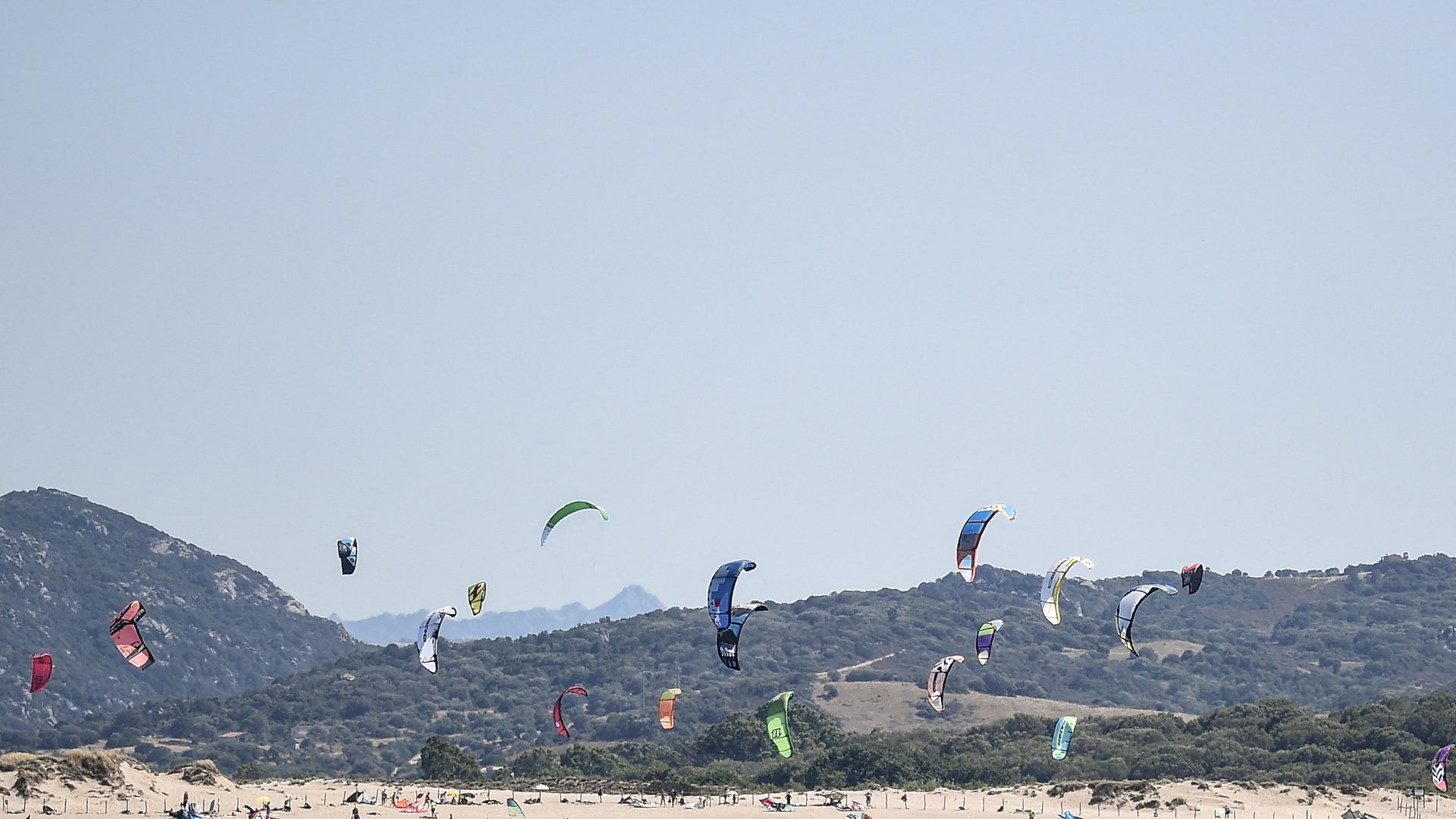 Porto Bollo Kitebeach very crowded with kitesurfers view from the sea