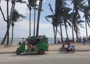 Green Tuktuk waiting for Passengers at White Beach Borocay
