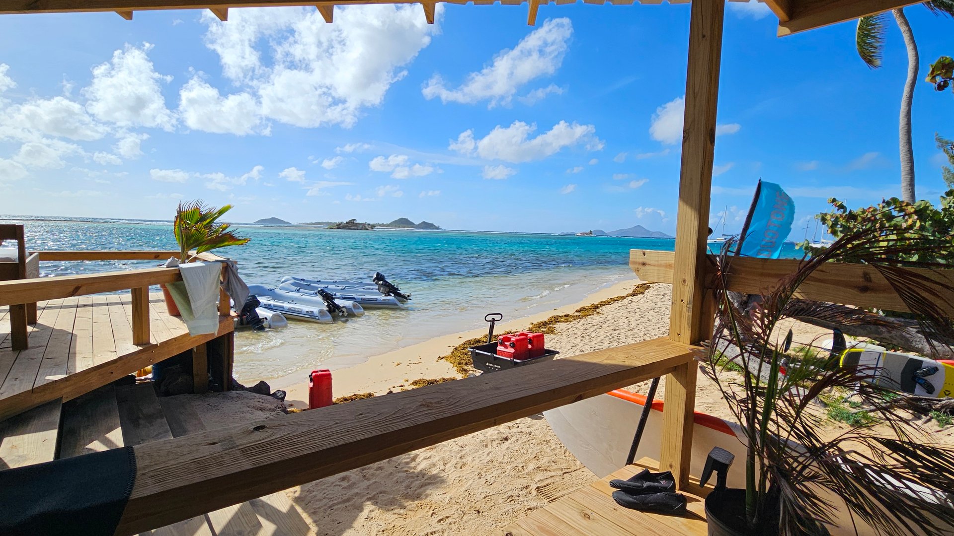 View on mirror flat water at Union Island Kitebeach in front of JT Pro Kite Center. 