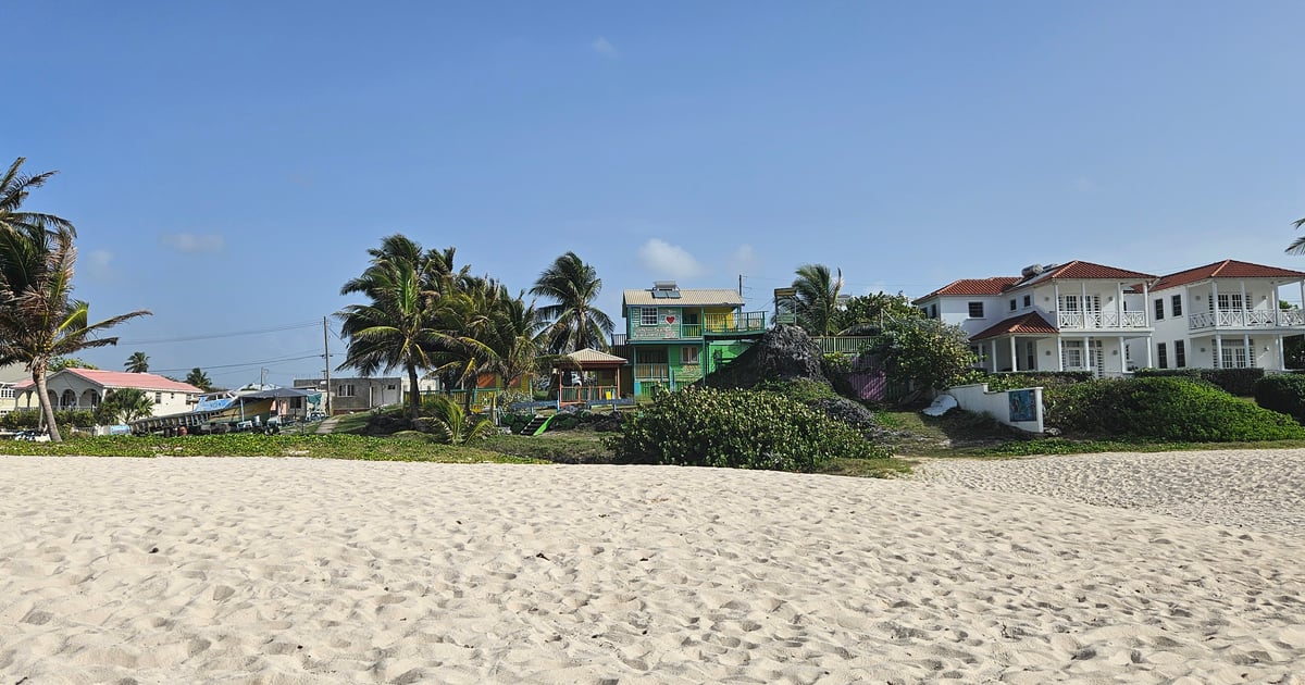 White beach with seagrass at Silver Sands and Rock with view to the Rock