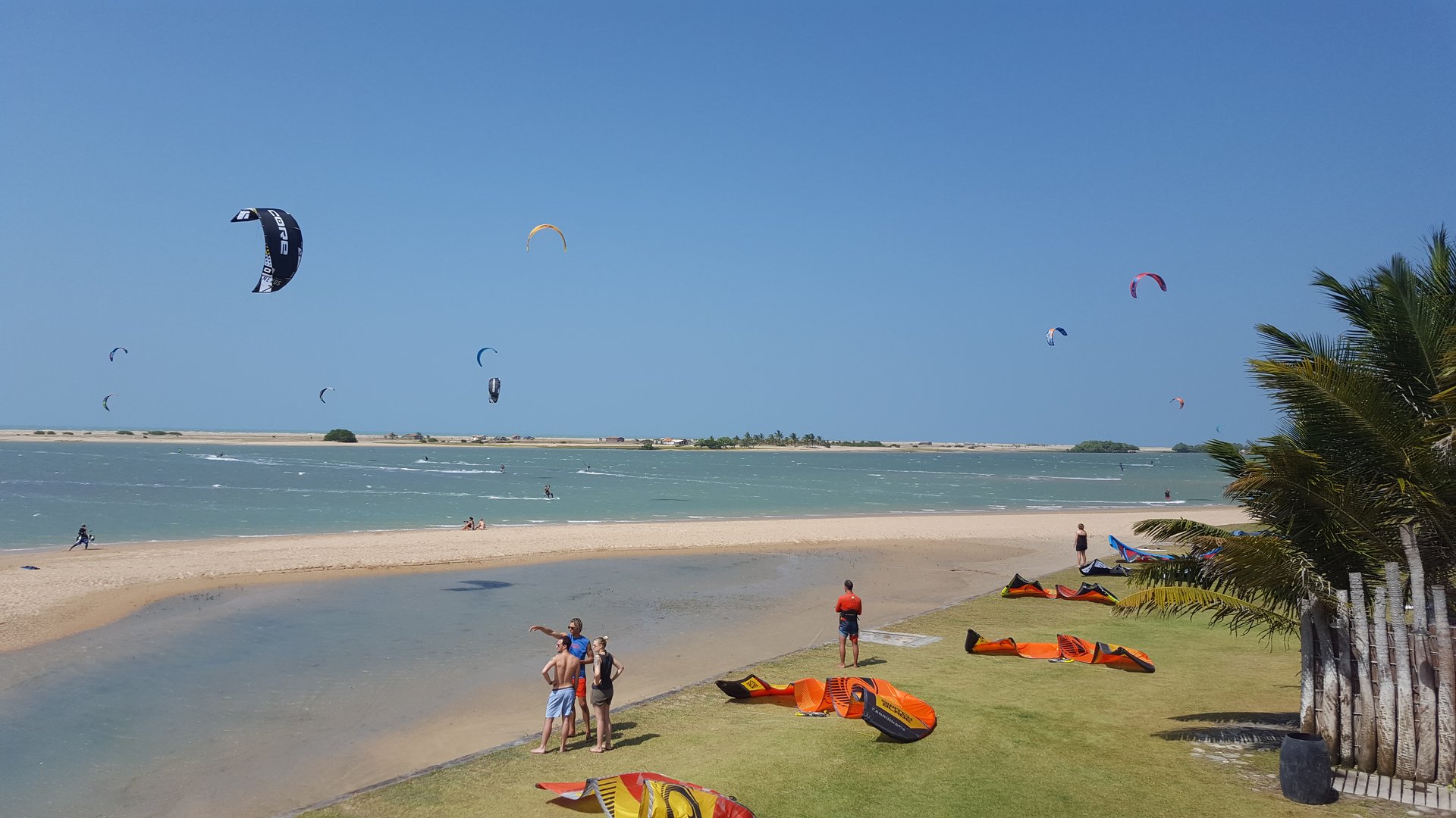 Ilha do Guajiru Lagoon filled with kiters. People getting ready for a session.