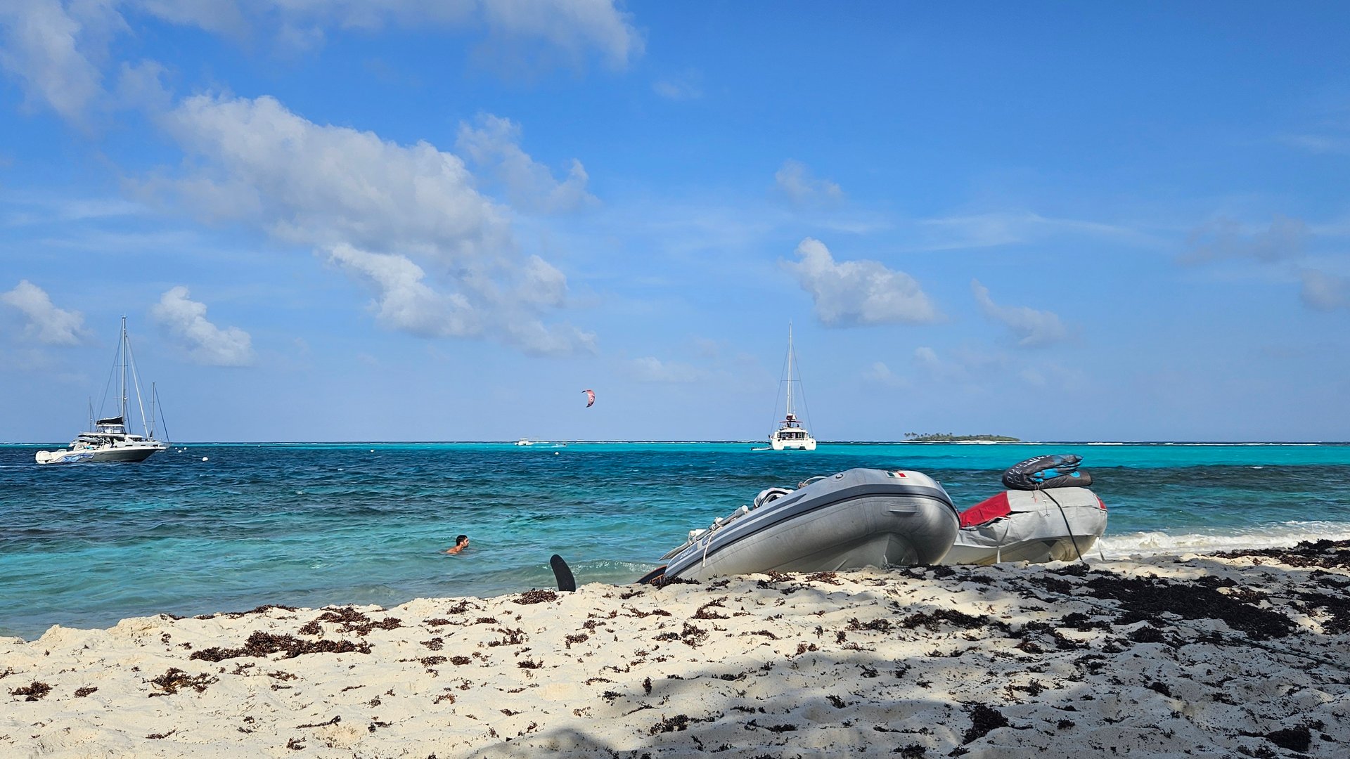 Small boats sitting on sand Tobago Cays