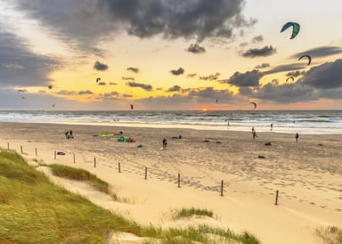 Zandvoort Aan Zee Kitesurfing seen from dunes at Sunset