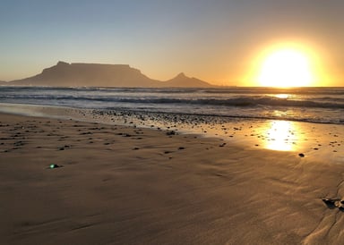 Sunset Beach Kitesurfing at Blouberg Strand with beautiful sunset with view to Table Top Mountain in South Africa Cape Town