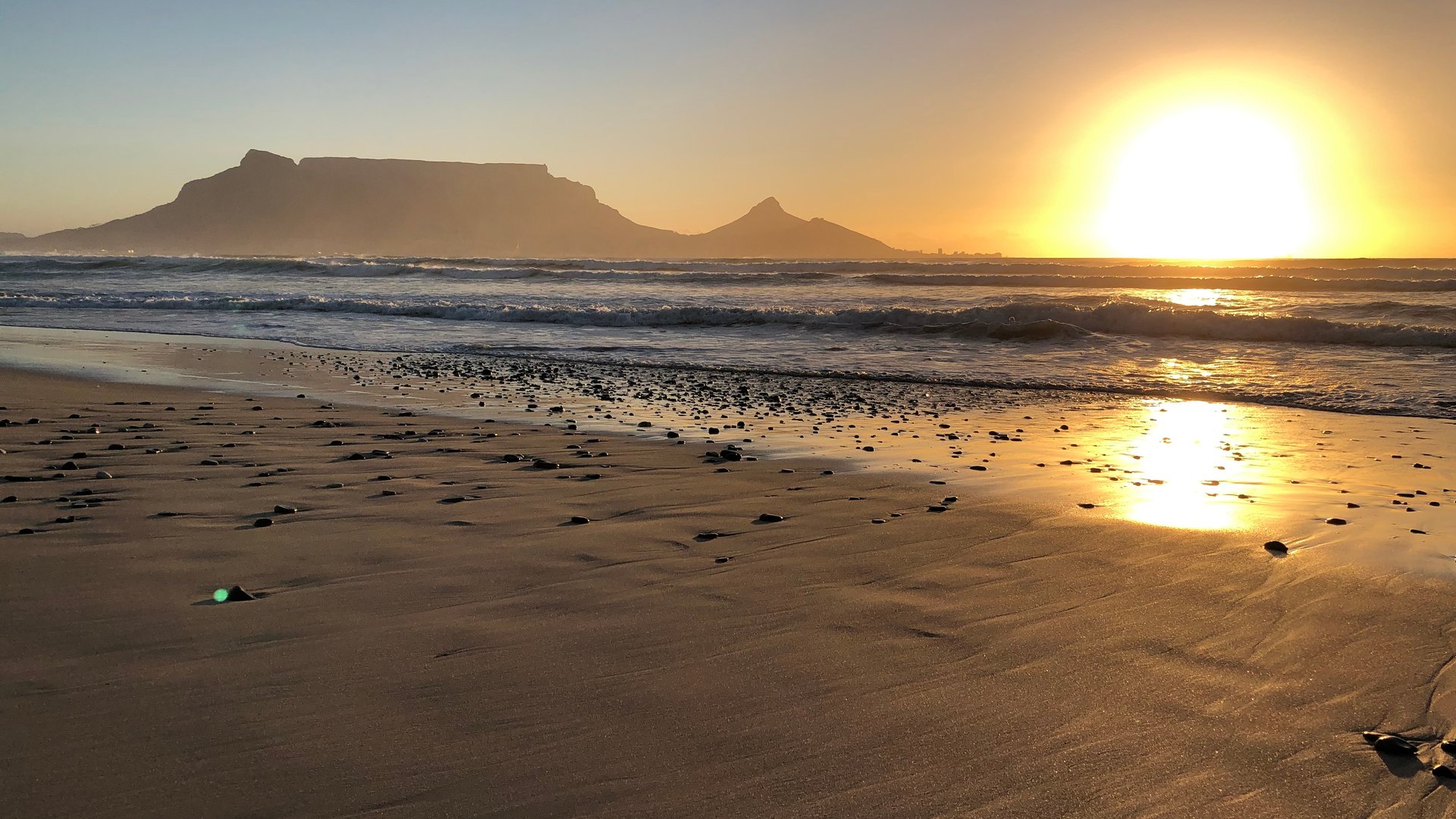 Sunset Beach Kitesurfing at Blouberg Strand with beautiful sunset with view to Table Top Mountain in South Africa Cape Town