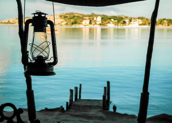 Lamp on the background of the sea and the coastline of Lamu Island Kenya