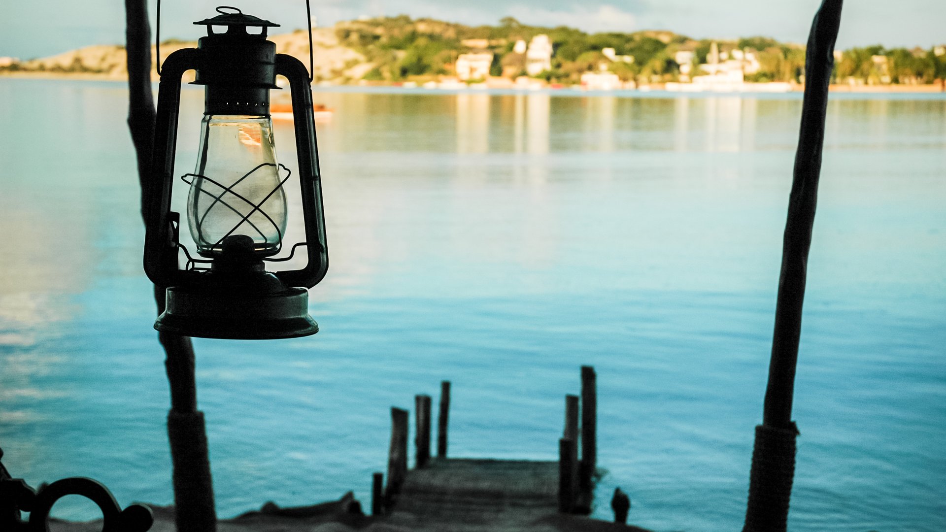 Lamp on the background of the sea and the coastline of Lamu Island Kenya