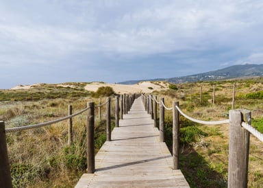 Empty wooden boardwalk on guincho beach portugal