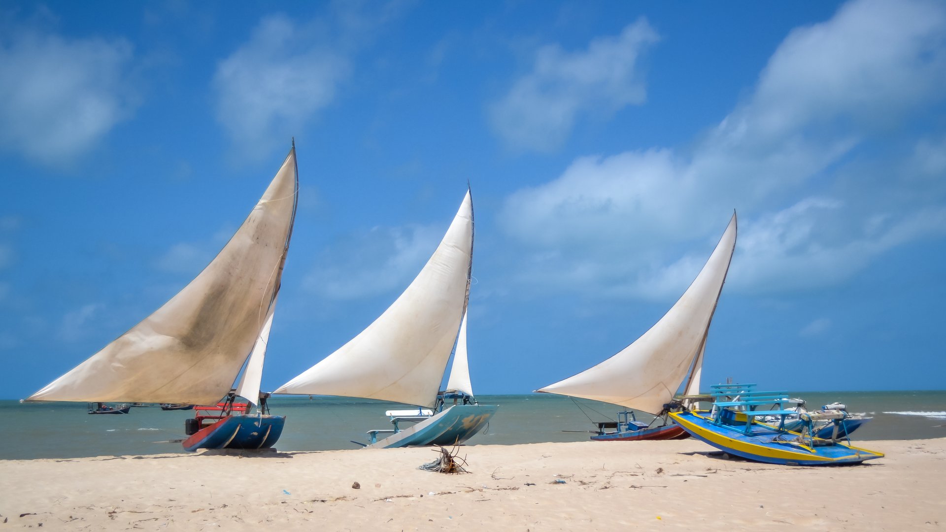 3 typical brazlian Sailboats lying at the coast in Sao Miguel do Gostoso