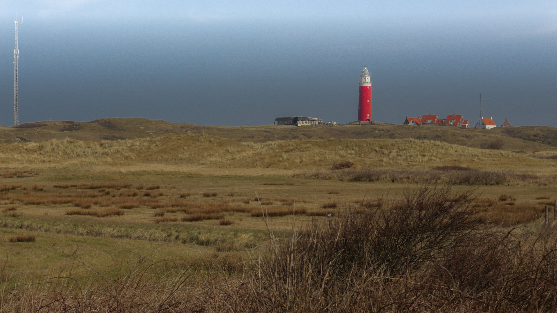 Texel Kitesurfing Island with lighthouse on the horizon of the sea